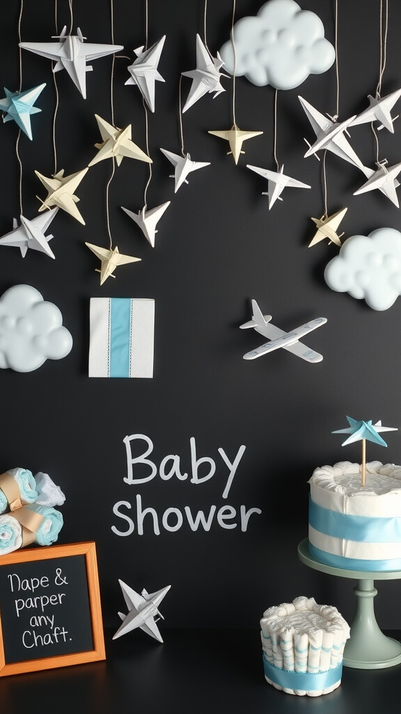 Decor for a baby shower featuring paper airplanes, clouds, and a cake.