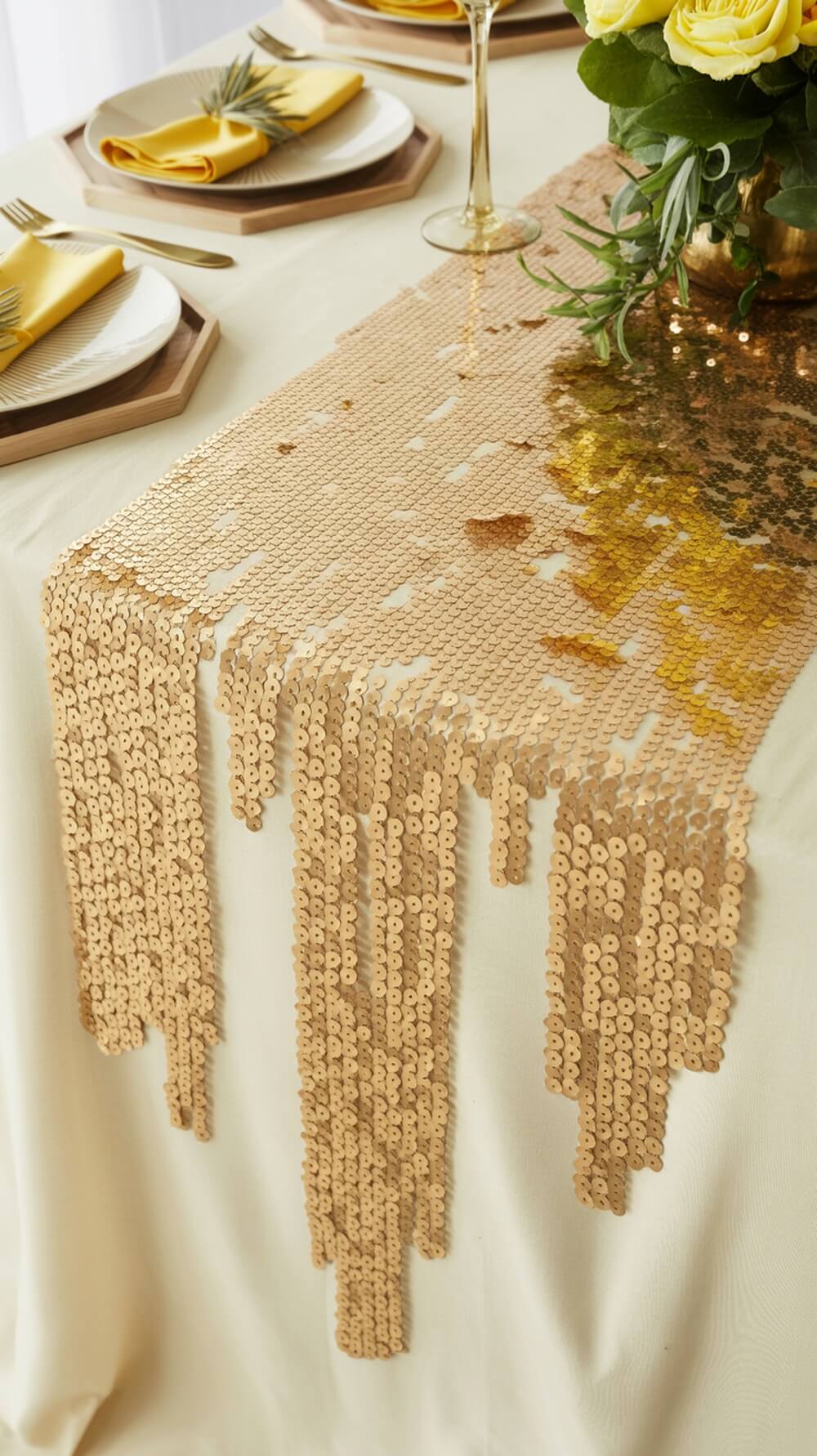 A shimmering gold sequined table runner on a table set for a baby shower.