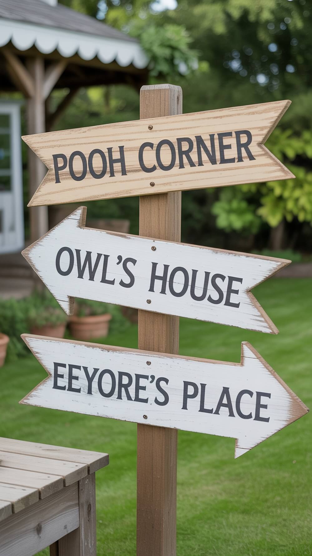 Wooden directional signs pointing to Pooh Corner, Owl's House, and Eeyore's Place