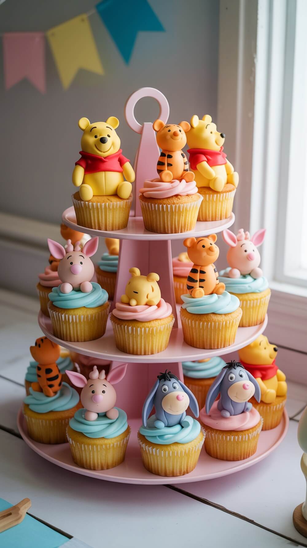 A tiered stand filled with colorful cupcakes featuring Winnie the Pooh and friends.