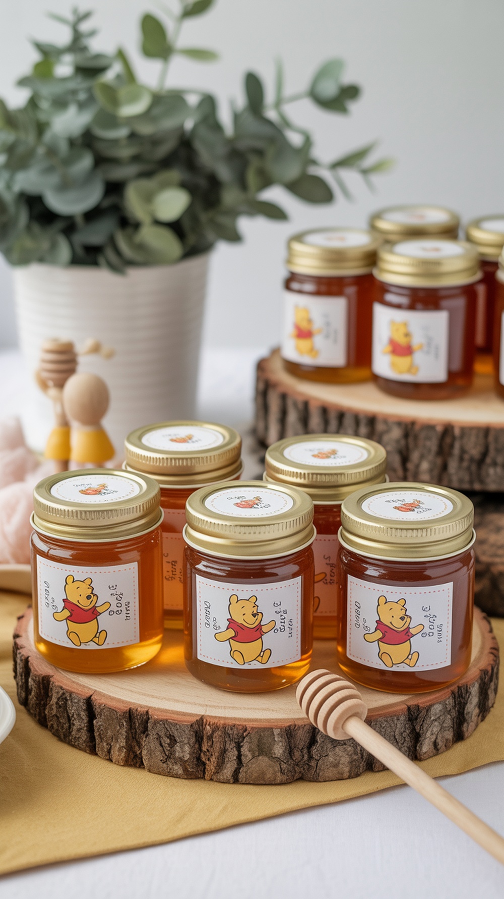 Honey jars with Winnie the Pooh labels on wooden slices, decorated for a baby shower.