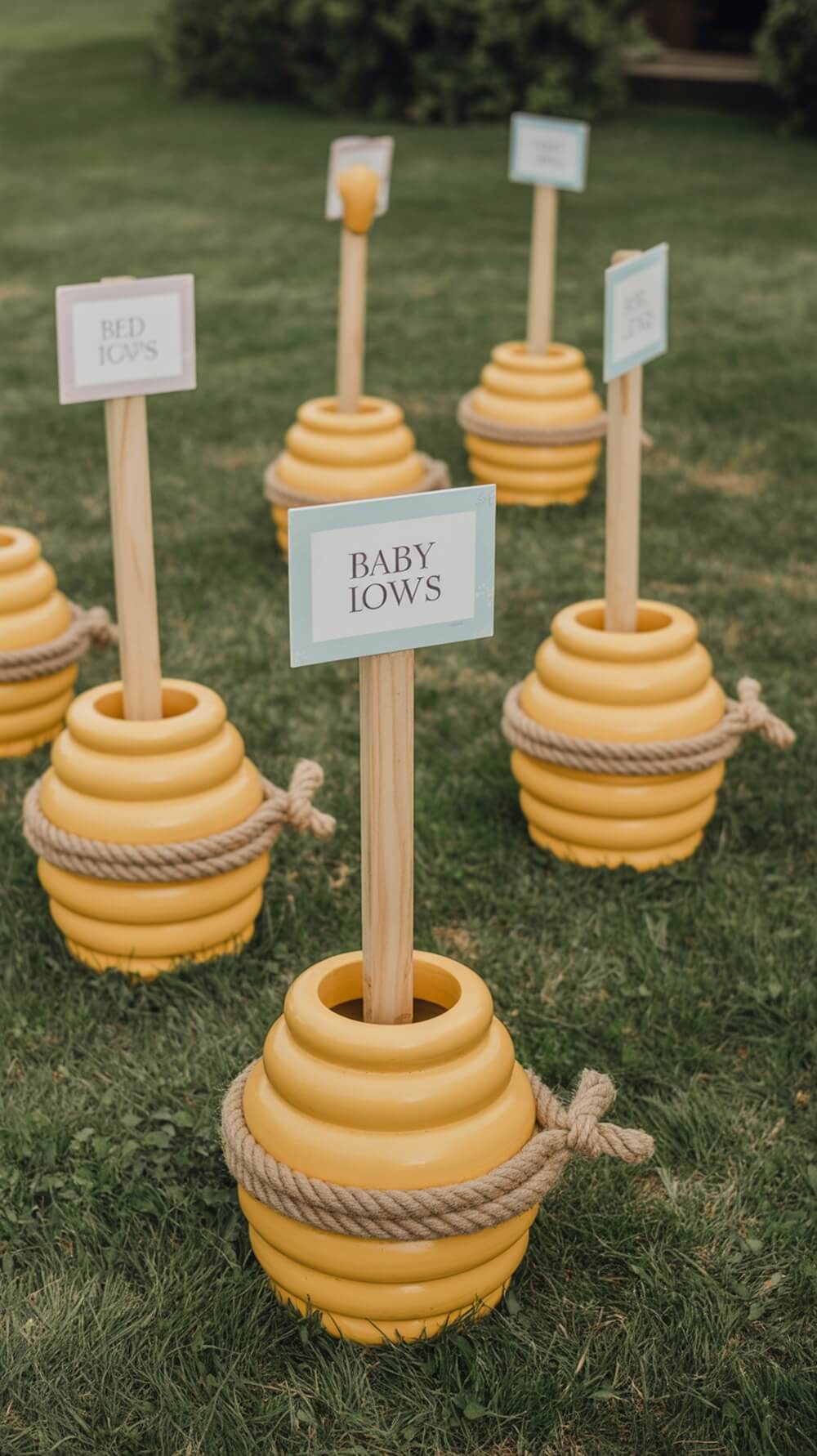 Honey pot ring toss game set up for a Winnie the Pooh themed baby shower