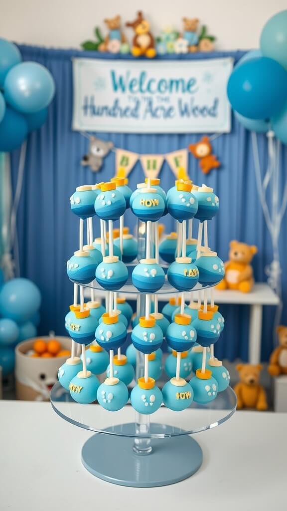 Two-tier blue ombré cake pop display featuring Winnie the Pooh themed decorations.